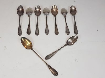 six spoons and two spoons are arranged in a heart shape
