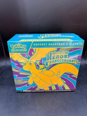 a box of pokemon trading cards with a yellow pokemon figure on it