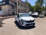 a white car that is parked in front of a building