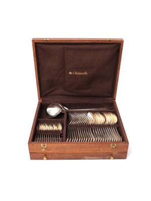 a wooden box with silverware in it on a white background
