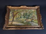an oil painting of a river and trees in a gold frame