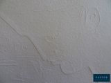 a picture of a white wall with a drawing on it