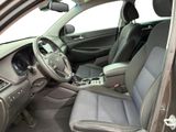 the interior of a car with a steering wheel and a center console