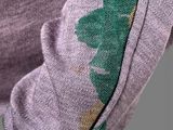 the back of a purple sweater with a pineapple print on it