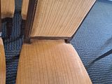 several chairs are lined up on a carpeted floor in a room