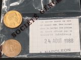 deux pièces dans un sachet en plastique sur lequel est collé un ticket