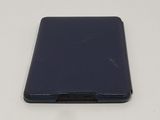 the back of a tablet with a leather case on a white surface