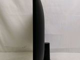 a black sculpture that is sitting on a white surface