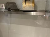 a white toilet sitting in a bathroom next to a sink