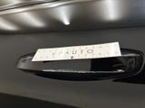 a sticker on the door handle of a car