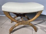an image of a wooden bench with a white leather seat