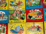 many children ' s books that are on the floor