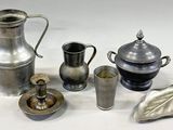 a lot of silver items that are on the table