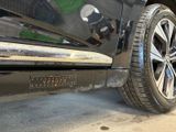 a close up of a car ' s tire on the street