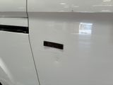 a close up of a car door with a sticker on it