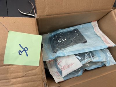 a cardboard box with a bunch of items inside of it