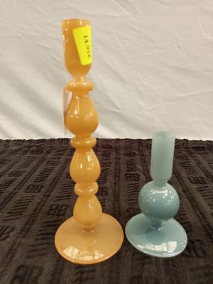 two vases sitting on a table with a price tag on them