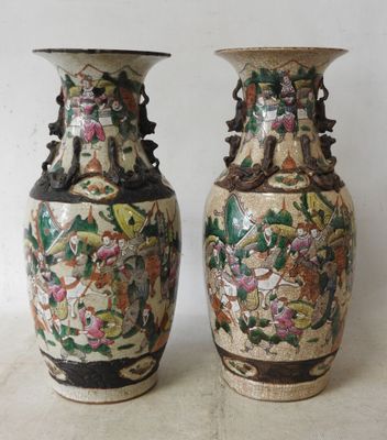 two vases that are sitting on a table