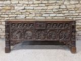 an old wooden chest with carvings and carvings on the sides