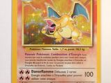 the pokemon card has a yellow background and a yellow dragon on it