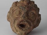 une image représentant une sculpture en argile représentant le visage d'un homme