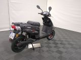 a scooter that is parked in a room
