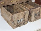 two wooden boxes sitting on top of a table