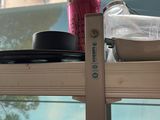 a glass shelf with dishes and cups on top of it