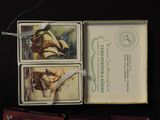 three cards in a box with a picture of a ship