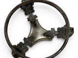an old metal object on a white surface with a white background