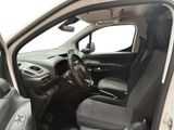 the interior of a car with the door open and the driver ' s seat down