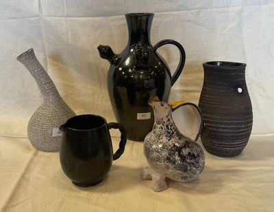 three vases sitting on a table next to each other