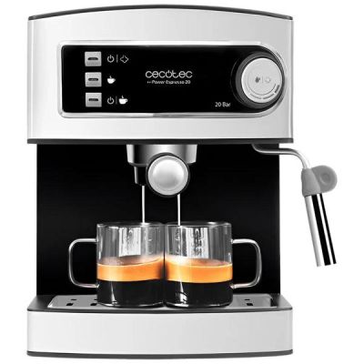 gros plan d'une machine à café avec deux tasses de café