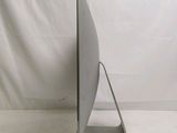 an apple macbook computer sitting on top of a metal stand