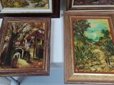 three framed paintings of a country scene on a white table