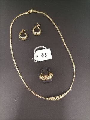 a close up of a necklace and earring on a table