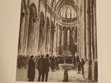 a black and white photo of a group of people in a church