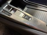 a close up of a car ' s dashboard with a clock on it