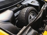 a close up of a car engine with the hood open