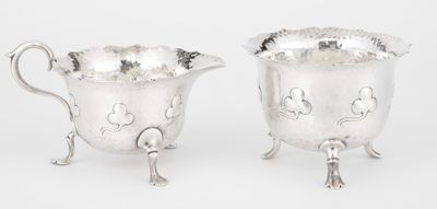 a pair of silverplated sugar and creamers on stands