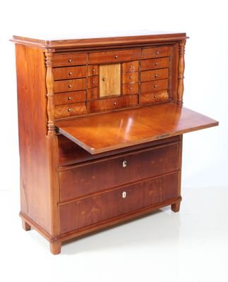 a wooden desk with drawers and a drawer underneath it