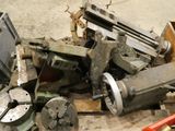 a pile of old tools sitting on the floor