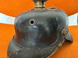a helmet that is sitting on an orange chair