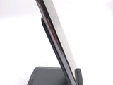 a cell phone that is on a stand on a table