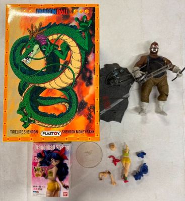 un dragon et un homme armé à côté d'une boîte de figurines