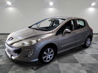a picture of a silver car parked on a checkered floor