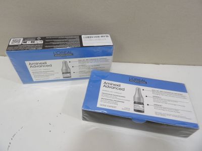 two boxes of blue and white adhesives on a white surface