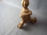 a small wooden table with a vase on top of it