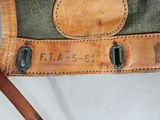 a close up of a purse with a tag on it