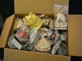 a cardboard box filled with assorted items on a table